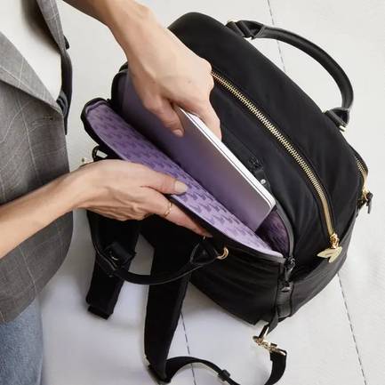 External Laptop Sleeve: An easy access compartment means no more rifling through your bag before a meeting. Fits up to a 13 inch laptop.