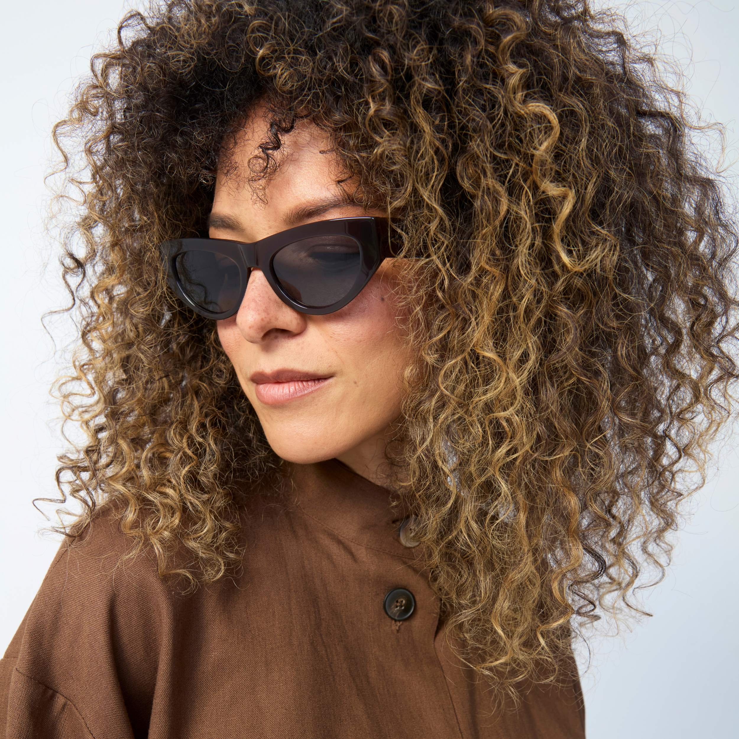 Photo of a man or woman wearing Béatrice Sun Havana Tortoise Sun Glasses by French Kiwis