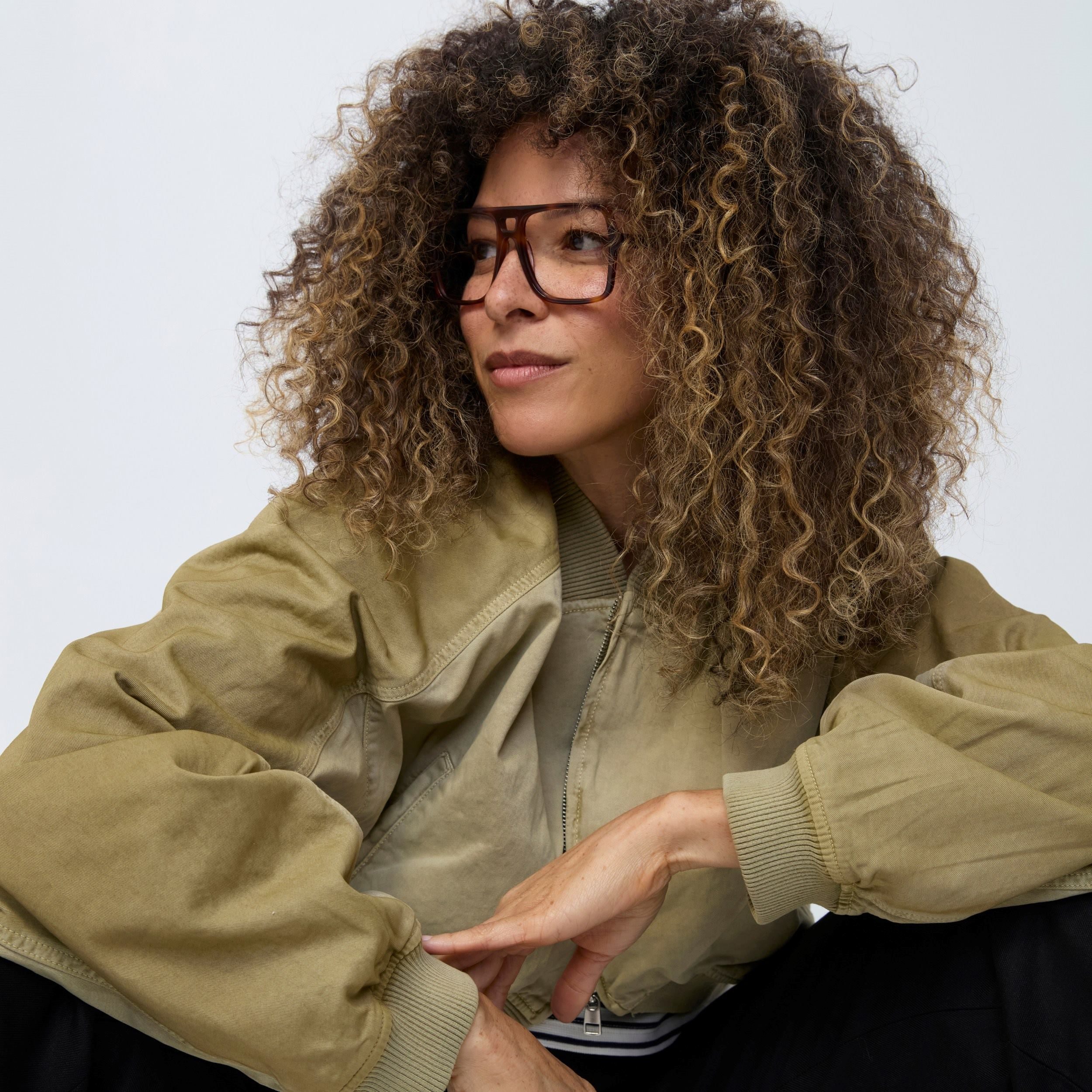 Photo of a man or woman wearing Dallas Clear Mocca Reading Glasses by French Kiwis