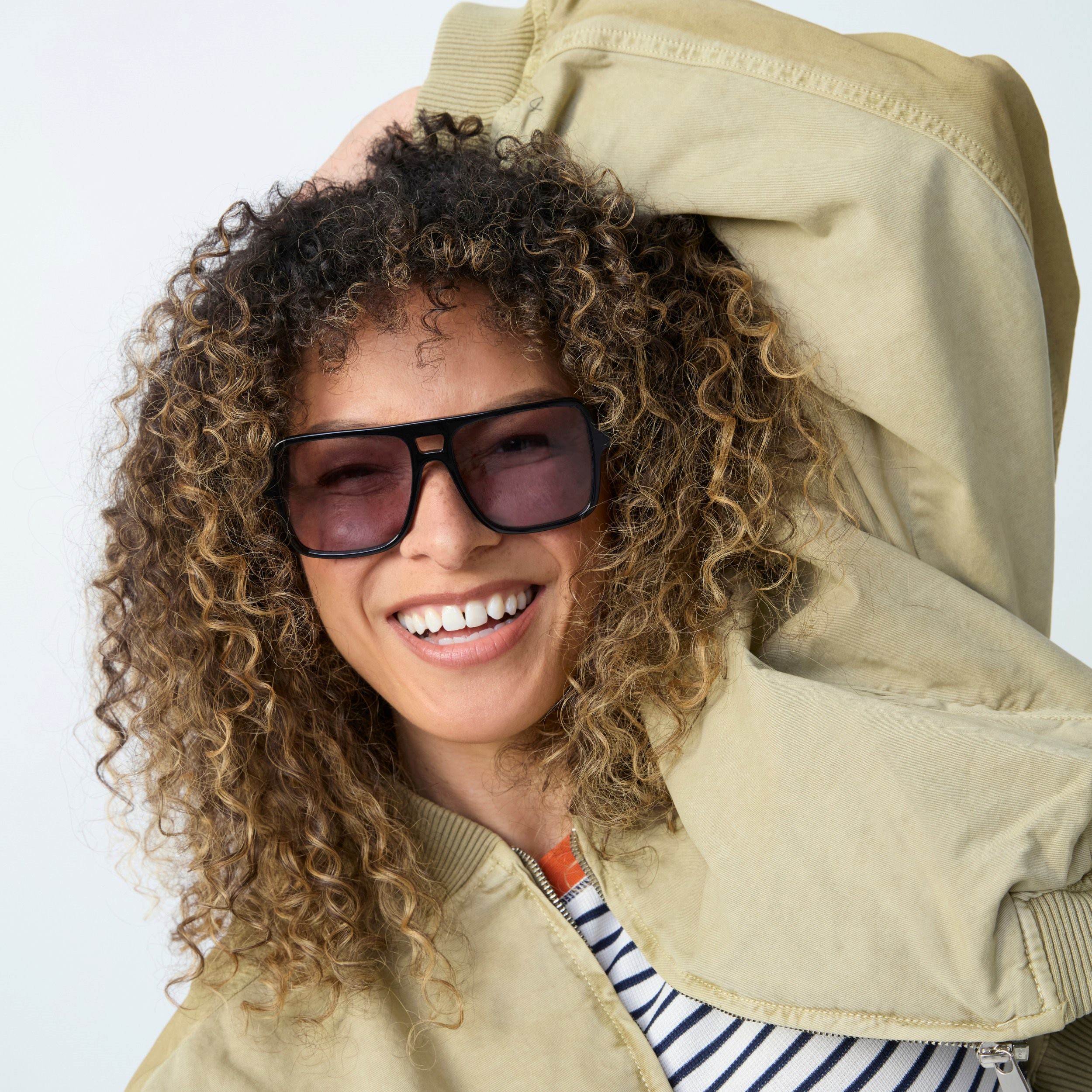 Photo of a man or woman wearing Dallas Sun Clear Mocca Sun Glasses by French Kiwis