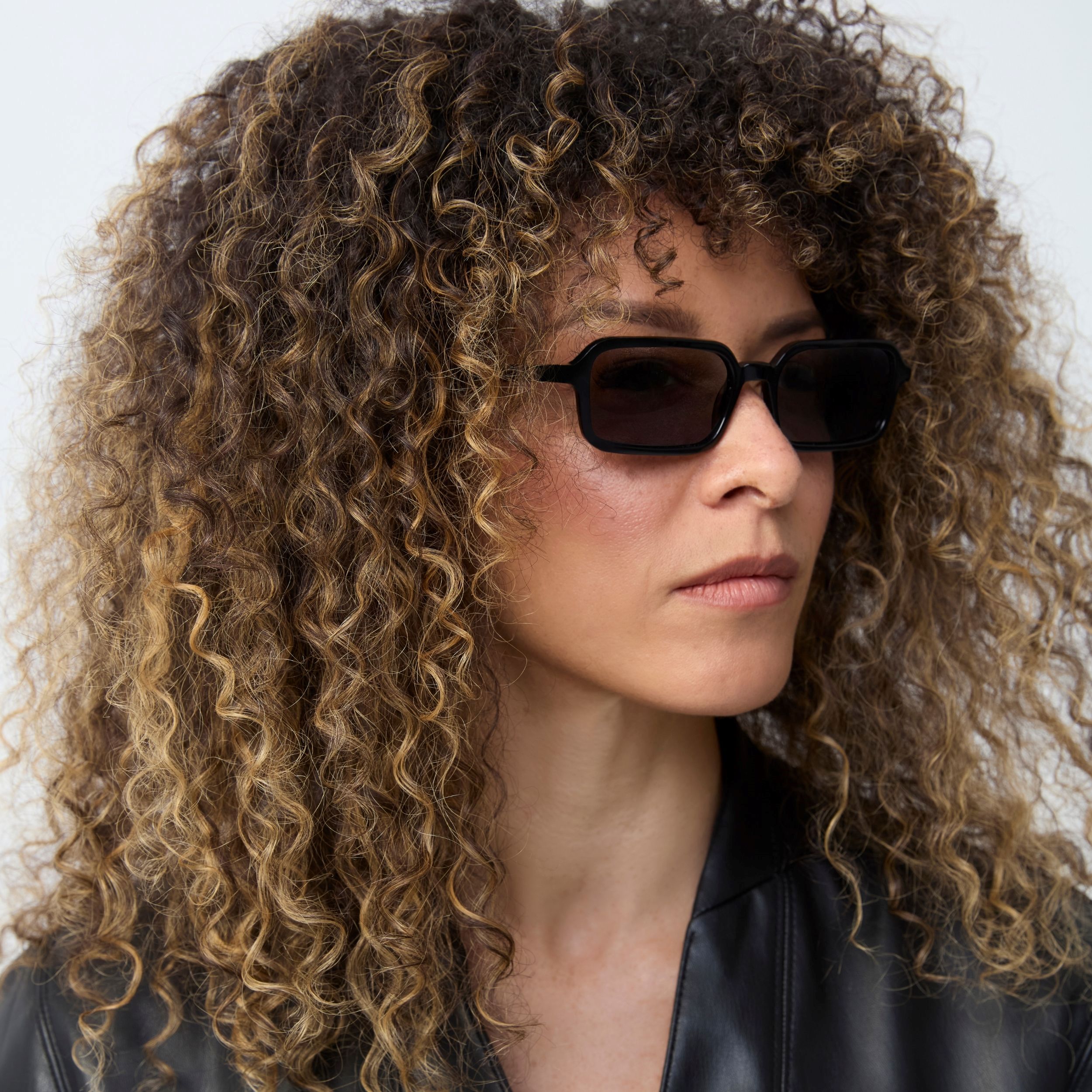 Photo of a man or woman wearing Lou Sun Black Sun Glasses by French Kiwis