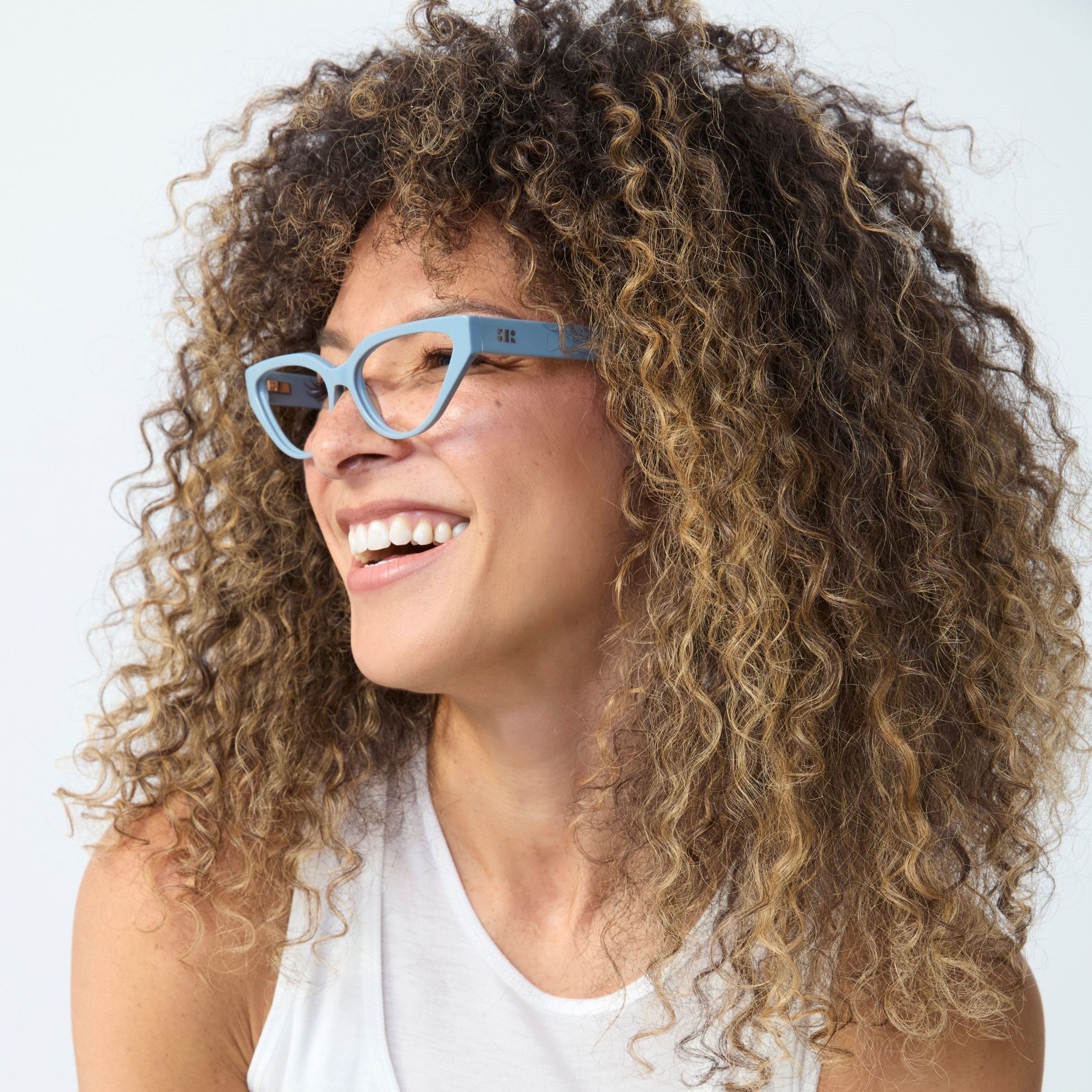 Photo of a man or woman wearing Nikki Blue Light Stone Blue Blue Light Glasses by French Kiwis