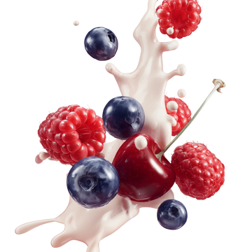 cherry blueberry and raspberry splashing out of milk