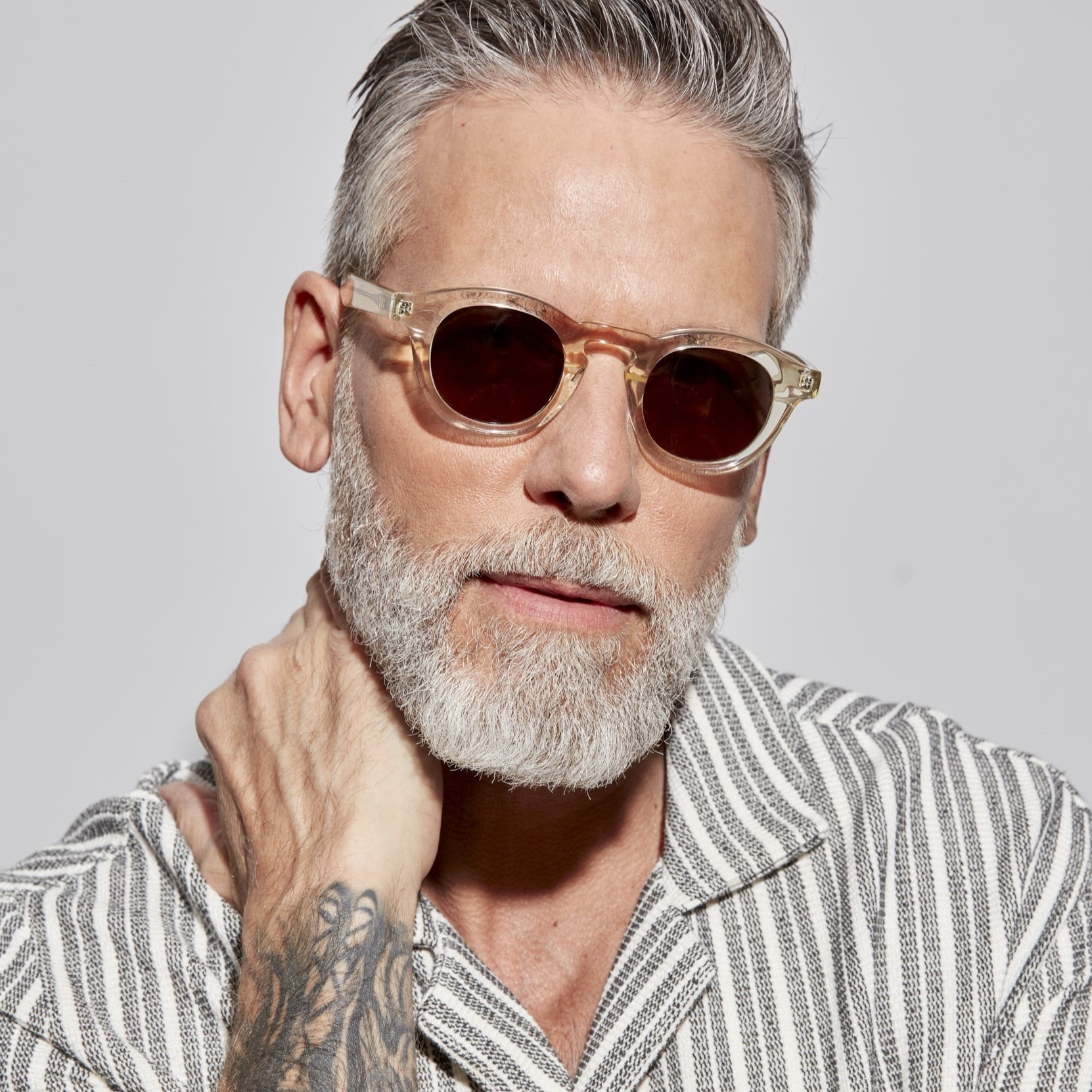 Photo of a man or woman wearing Jude Sun Clear Dark Olive Sun Glasses by French Kiwis