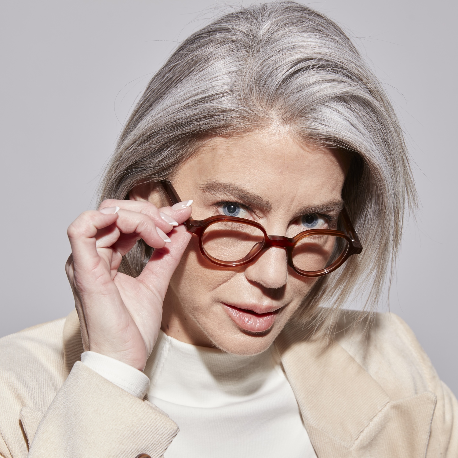 Photo of a man or woman wearing Gaby Blue Light Clear Dark Olive Blue Light Glasses by French Kiwis