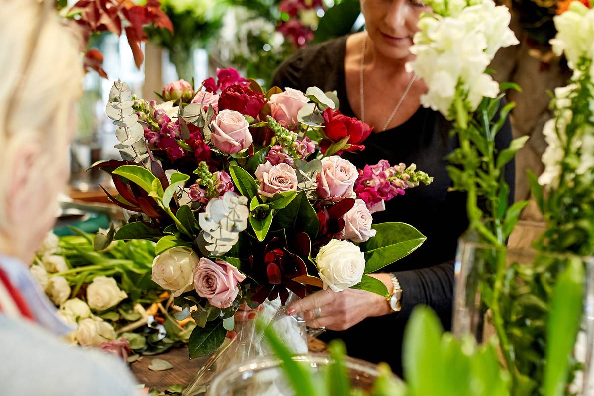 One of our talent florists with a stunning fresh flower arrangement at our Collaroy, NSW store.