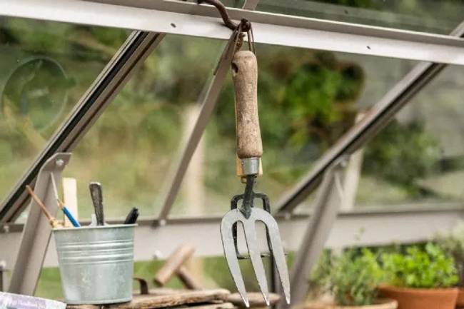 Tools hanging up in a greenhouse