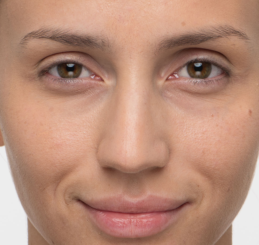 Close-up of eyebrows before using Obagi Nu-Cil Eyebrow Boosting Serum, with visible gaps.