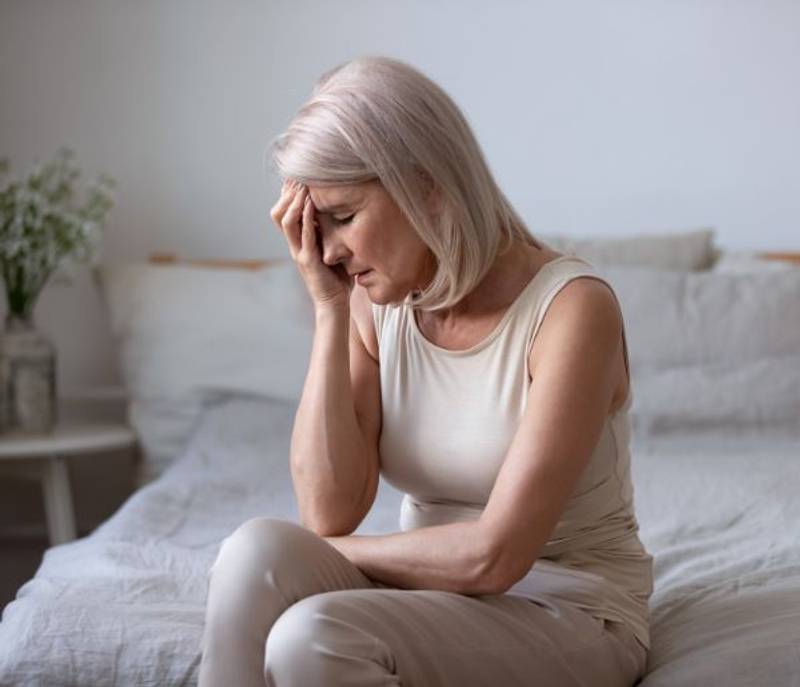 Older Woman In Despair: Menopause Stress.